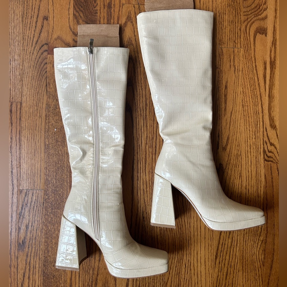 Cream colored knee high boots by Princess Polly